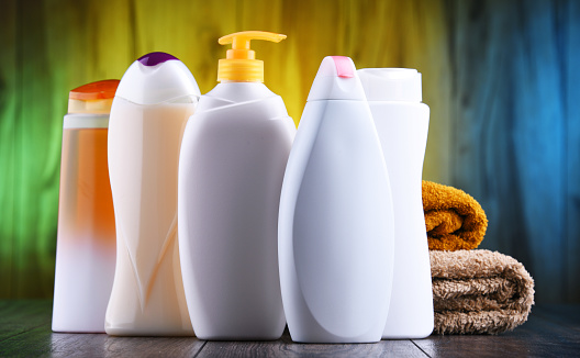 Plastic bottles of body care and beauty products.