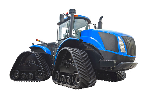 Large crawler tractor with rubber tracks, isolated on a white background