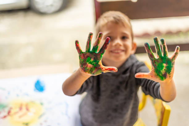istock Boy showing his colorful hands 1160727008