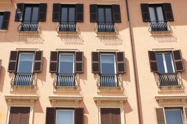Window in Rome with a partly closed Blind.