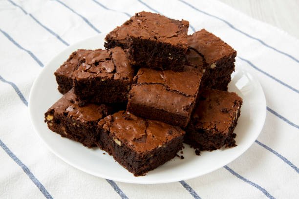 istock Homemade chocolate brownies on a white plate, low angle view. Close-up. 1160729030