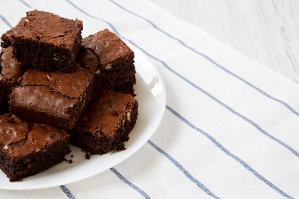 istock Homemade chocolate brownies on a white plate, side view. Close-up. Copy space. 1160729066