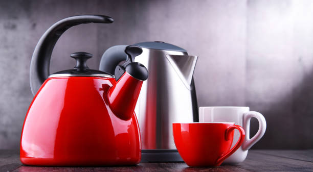 istock stovetop kettle with whistle and electric cordless kettle 1160729144