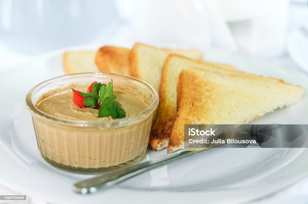 Liver pate with toast Homemade liver pate with crispy slices of bread. Close-up, selective focus Liver Pâté Stock Photo