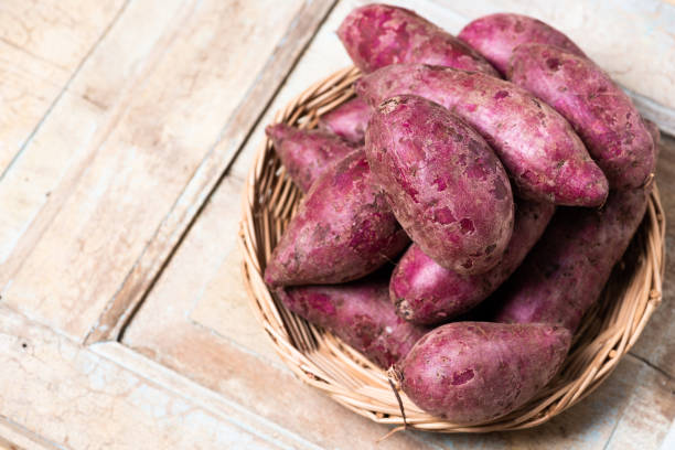 istock Sweet Potatoes Purple Colored on Table 1160734005