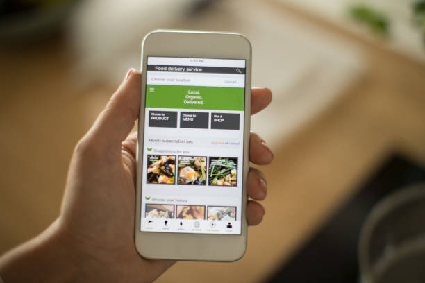 istock Woman using meal delivery service through mobile app. 1160735347