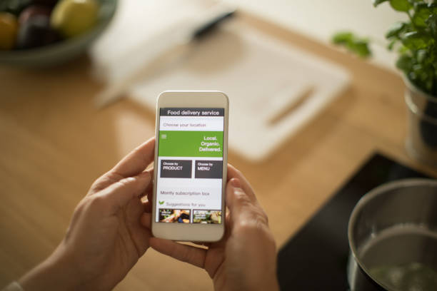 istock Woman using meal delivery service through mobile app. 1160735873