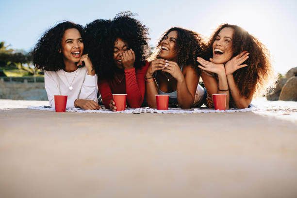 istock Girls hanging out at beach 1160738626