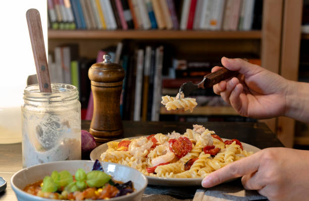 istock homemade dinner: salmon sauce fusilli with shrimp and tomato 1160738813