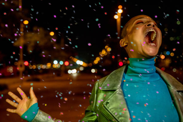 Cool woman under a rain of confetti