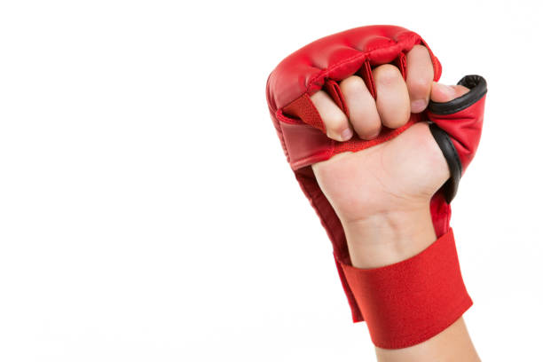 istock on the children's hand a red glove for karate, pointing up, concept, on a white background 1160744763