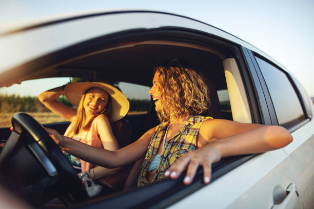 istock Cheerful girls going of a journey 1160745381