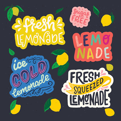 Set hand drawn lettering inscriptions on dark background with flat style lemon fruits and leaves. Stickers with Sugar Free, Fresh, Ice Cold and Squeezed Lemonade. Perfect for cover, menu, cafe, poster