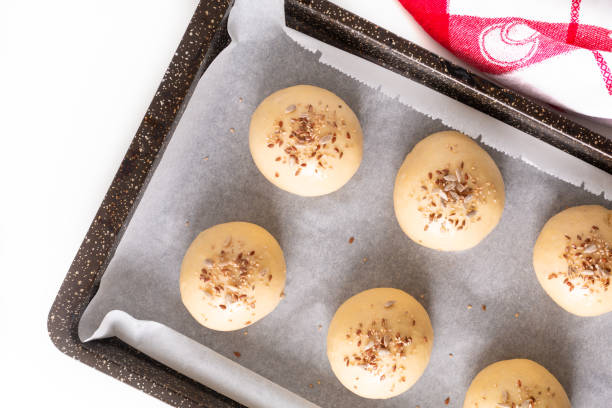 istock Food concept Proving, Proofing yeast dough of hamburger buns in bake pan before baking 1160745909