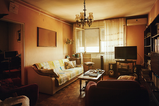 Interior of an old and retro style living room during day.