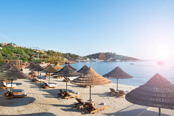 istock Beach chairs with umbrellas and beautiful sand beach 1160749059