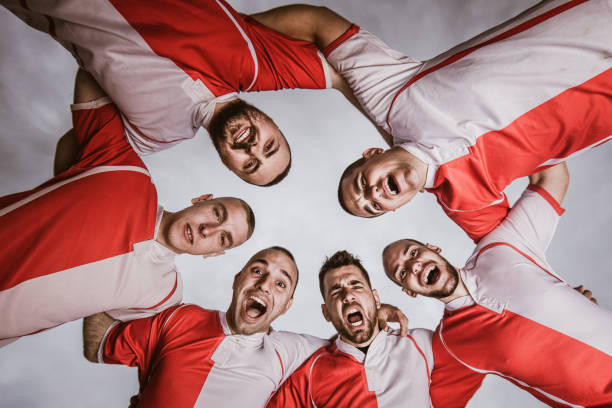 Rear view of soccer team players.