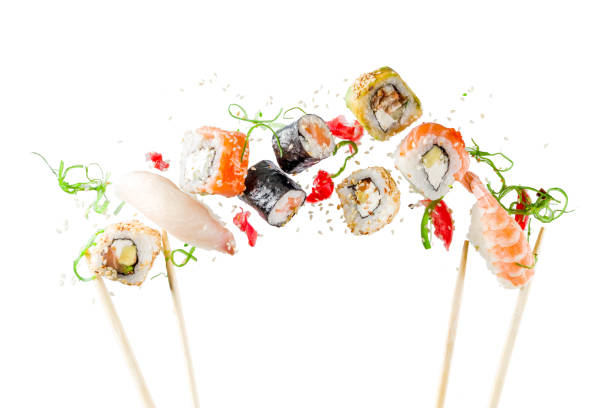Seamless pattern with sushi Seamless pattern with sushi. Food abstract background. Flying sushi, sashimi and rolls isolated on the white background. fusion food stock pictures, royalty-free photos & images