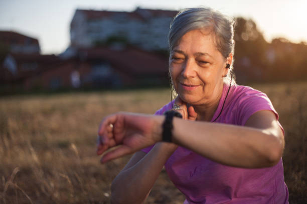 Senior Woman Checking Her Pulse After Exercise Close up of Senior Woman Checking Her Pulse After Exercise human cardiopulmonary system audio stock pictures, royalty-free photos & images