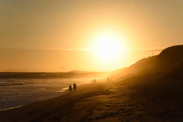 istock Elderly Couple Walking On Afternoon Sunset Beach 1160751789