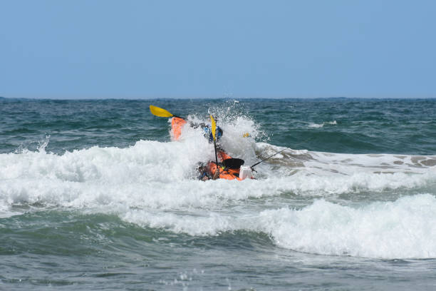 istock Ocean Kayak Crashing Through The Waves 1160751943