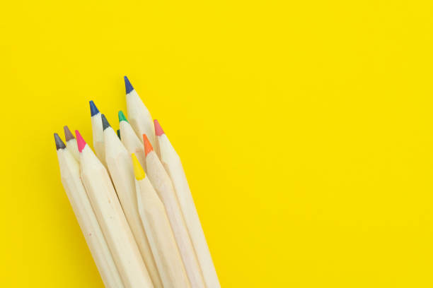 istock Vaious color pencils on solid yellow background, divesify or creativity concept or children art and education 1160752232
