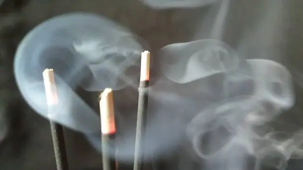 Photo of Incense sticks and smoke