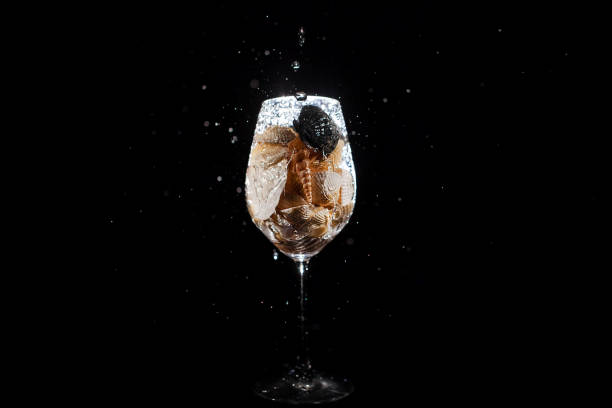 istock Waterdrops splash against wineglass with shells 1160762703