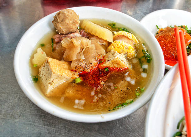 Broth bowl for noodles soup Khmer street food- Broth bowl for noodles soup in Toul Tom Pong street in phnom Penh, Cambodia khmer stock pictures, royalty-free photos & images