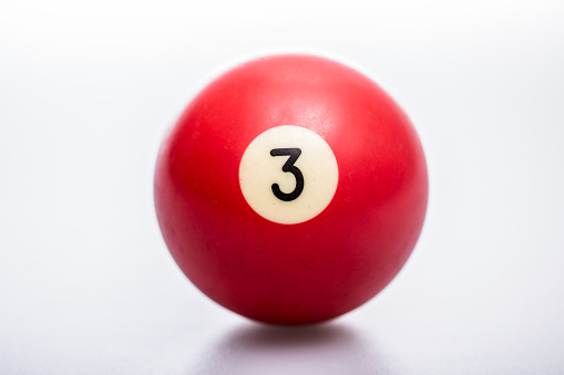 close-up of a pool ball on a white background