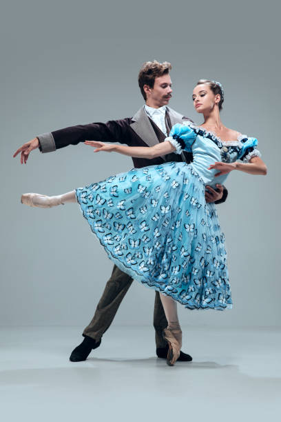 istock Contemporary ballroom dancers on grey studio background 1160766883