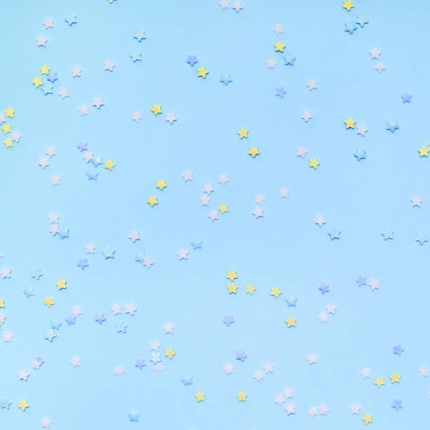 istock Little stars confetti on blue background 1160767399