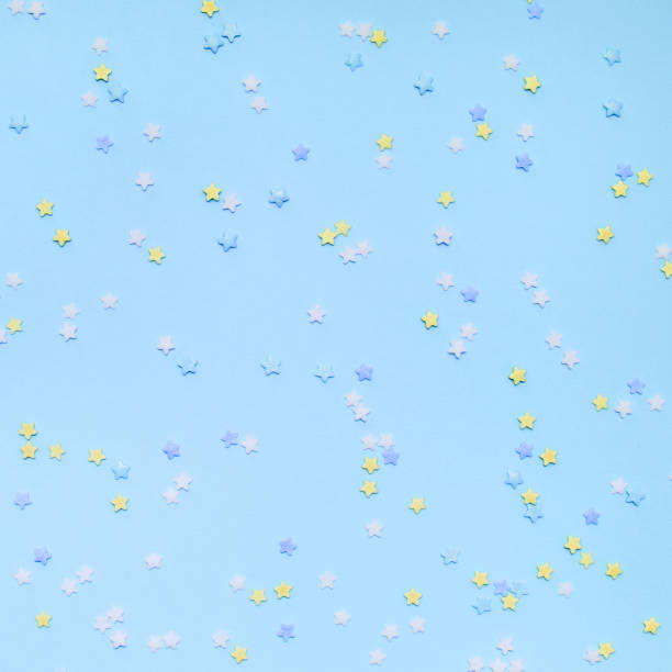 istock Little stars confetti on blue background 1160767401