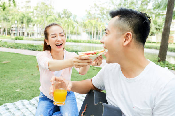 istock Couple having lunch outdoors 1160767644
