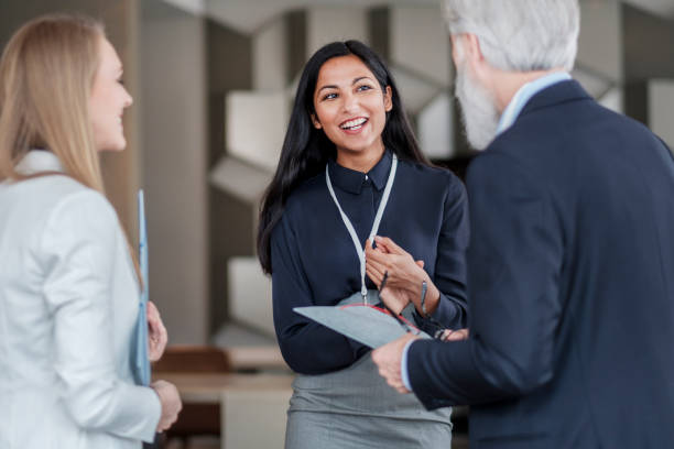 istock Group of business people laughing in the office 1160772452