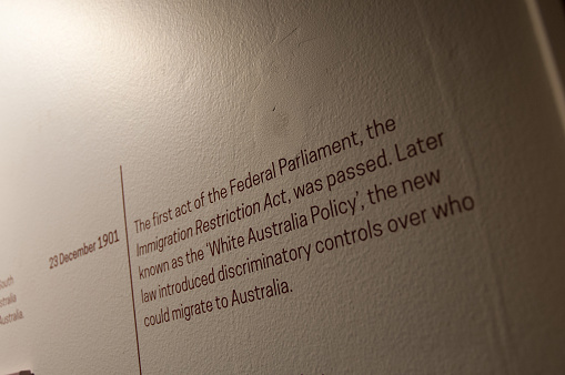 Melbourne, Australia - July 26, 2018: White Australia Policy on 23 December 1901 explanation text on white wall