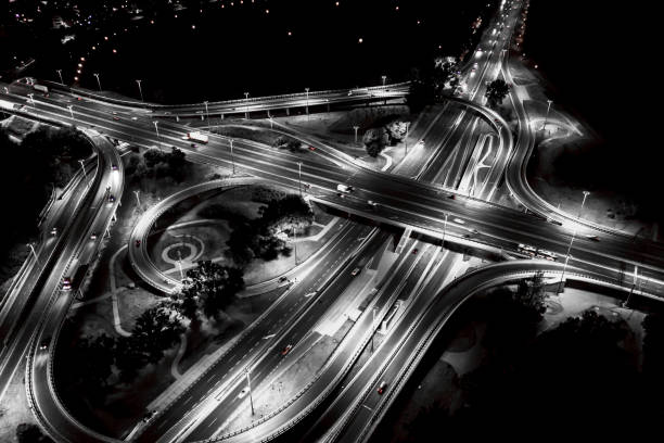 istock Aerial view Expressway motorway highway circus intersection at Night time Top view , Road traffic in city 1160775186