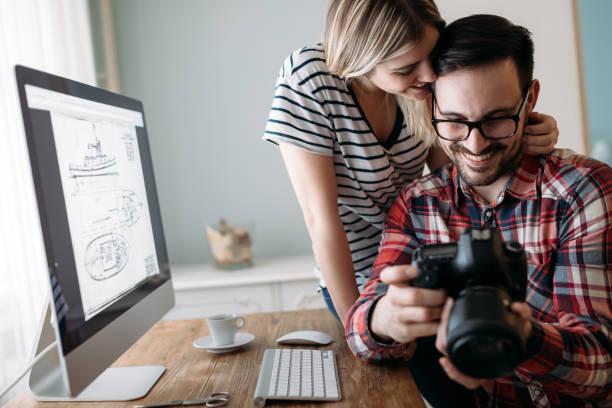istock Young attractive designers working on project together 1160777011