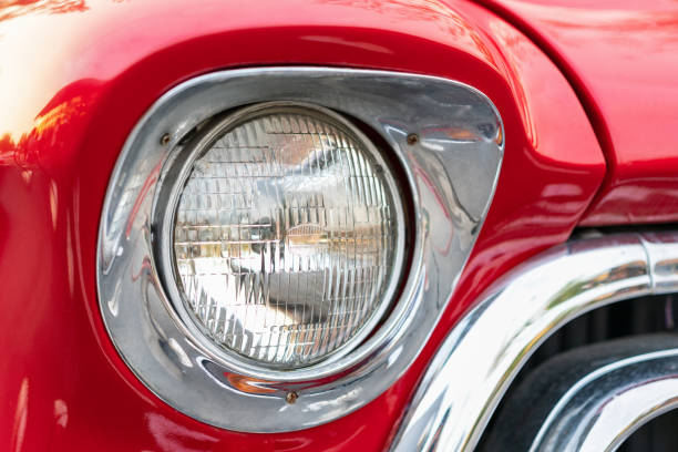 istock Close-up of Classic red car headlights. 1160777878