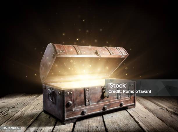 Treasure Chest Open Ancient Trunk With Glowing Magic Lights In The Dark Stock Photo - Download Image Now