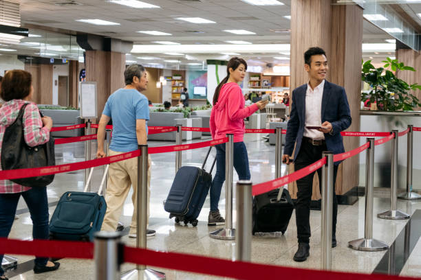 istock Chinese airline passengers with luggage 1160778503