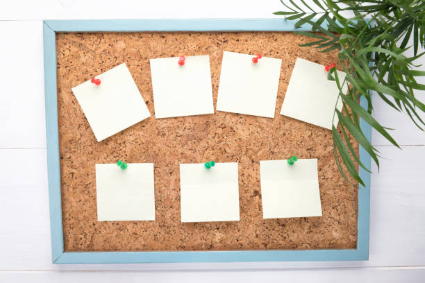 istock seven stickers or letterheads on a corkboard, a notification concept, copy space 1160778588