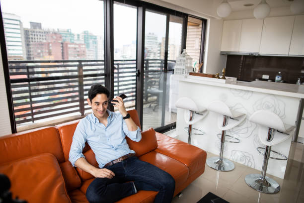 istock Man with hearing aid listening voice message 1160779754