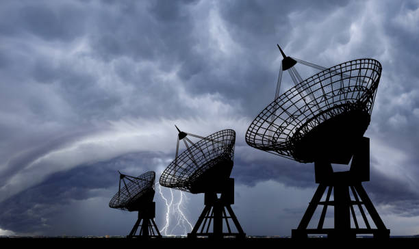 Satellite dishes at thundershtorm. Three Communication Satellite dishes at thundershtorm . radar stock pictures, royalty-free photos & images