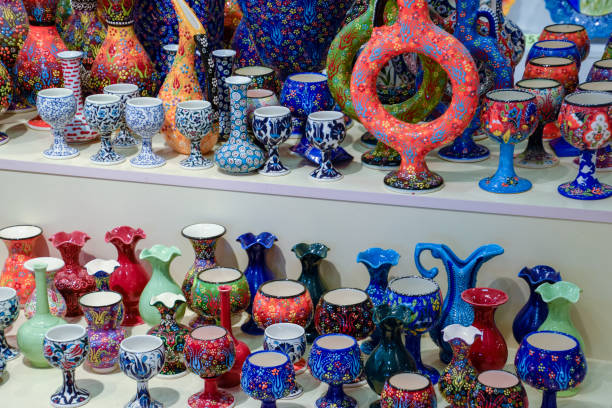 istock Painted vases and glasses on counter. Decorated dishes. 1160784988