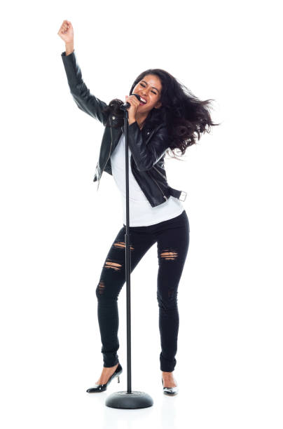 istock Bautiful woman wearing a leather jacket and singing like a rock star 1160785512