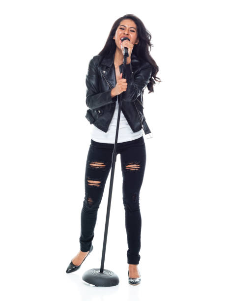 istock Bautiful woman wearing a leather jacket and singing like a rock star 1160785523