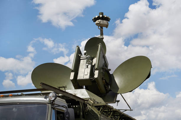 Military radar mobile complex Military radar mobile complex against the sky with clouds. Radio monitoring and interception. anti aircraft photos stock pictures, royalty-free photos & images