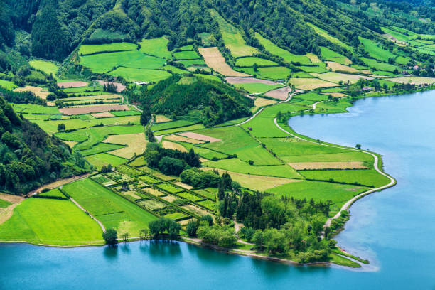 istock Agricultural fields near scenic lake 1160788120