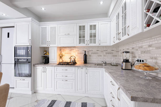 modern white wooden kitchen interior interior of modern white wooden kitchen in luxury home neo classical photos stock pictures, royalty-free photos & images